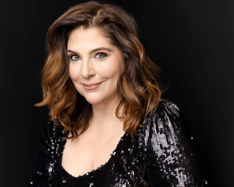 Eve Gigliotti against a black background